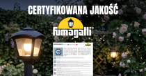 Baner marketingowy artykułu o oświetleniu Fumagalli, zatytułowany „Certyfikowana jakość”, pokazujący czarną latarnię ogrodową na tle ogrodu z różami, z logo Fumagalli oraz widocznym certyfikatem TÜV potwierdzającym spełnienie norm.